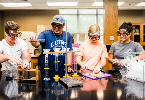 ABAC students in a science lab.