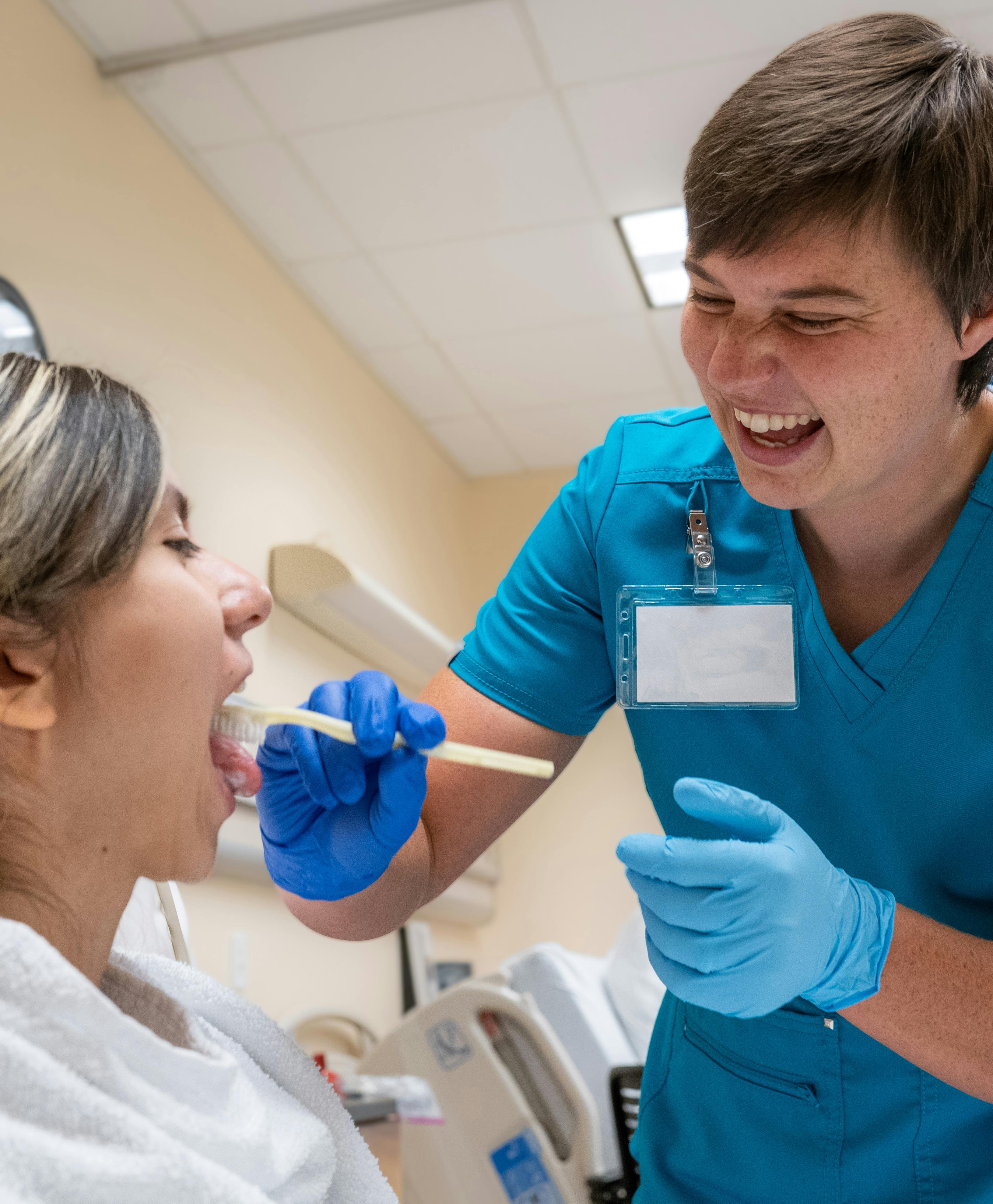 Aims Nurse Aide students practicing patient care in a lab setting