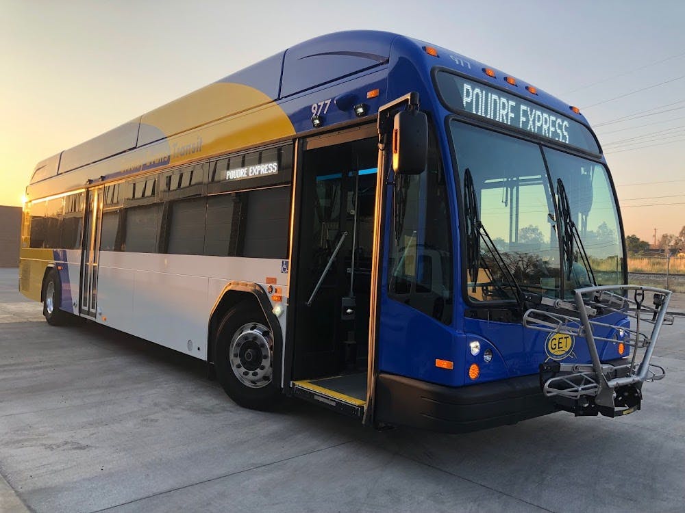 blue, white, and yellow painted bus 