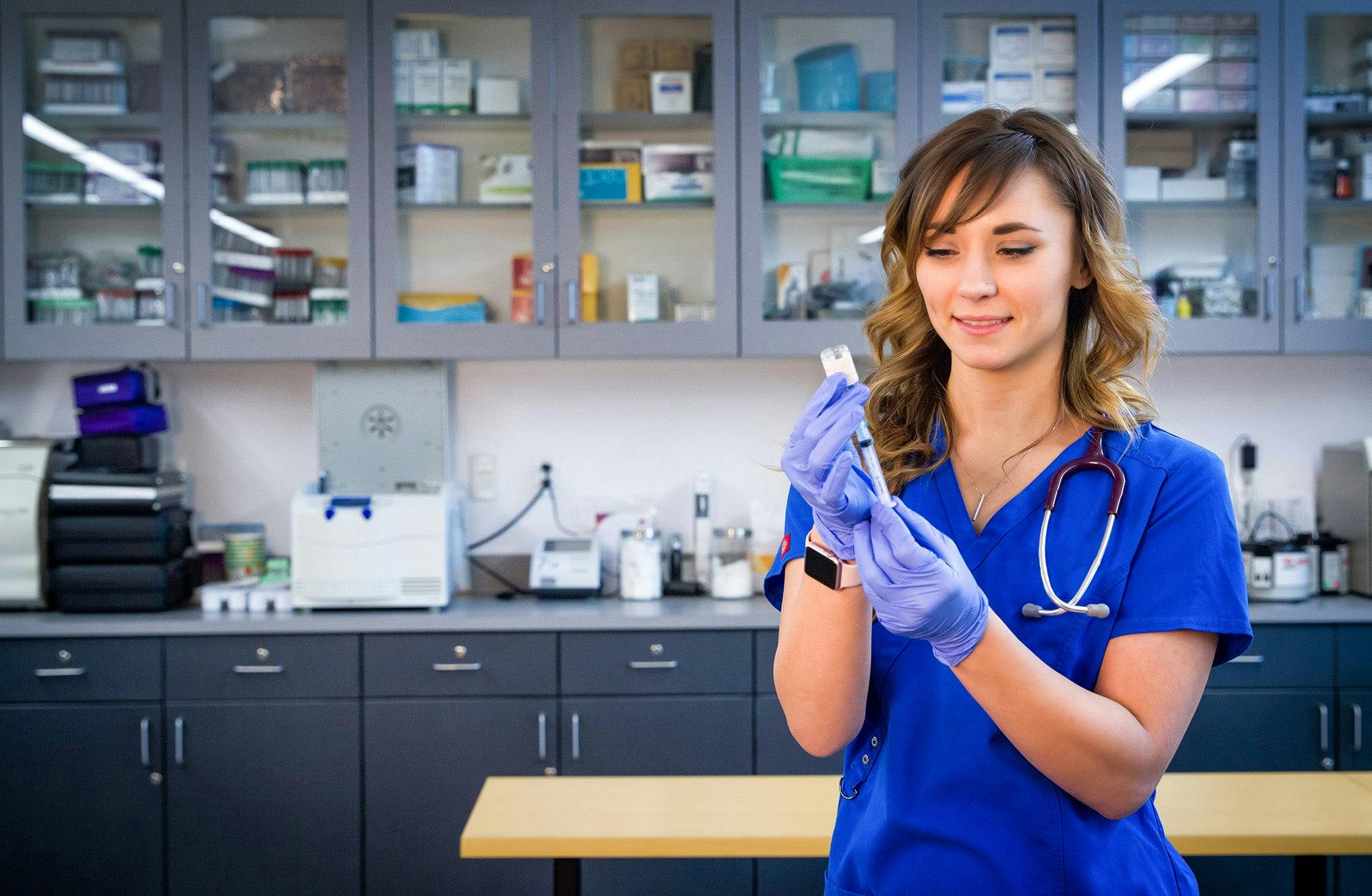 Aims Acute Care Nurse Aide students practicing patient care in a lab