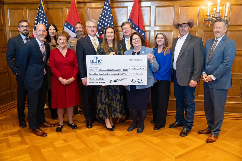 Photo of ASU-Beebe being presented a grant check from governor for expansion of workforce programming.
