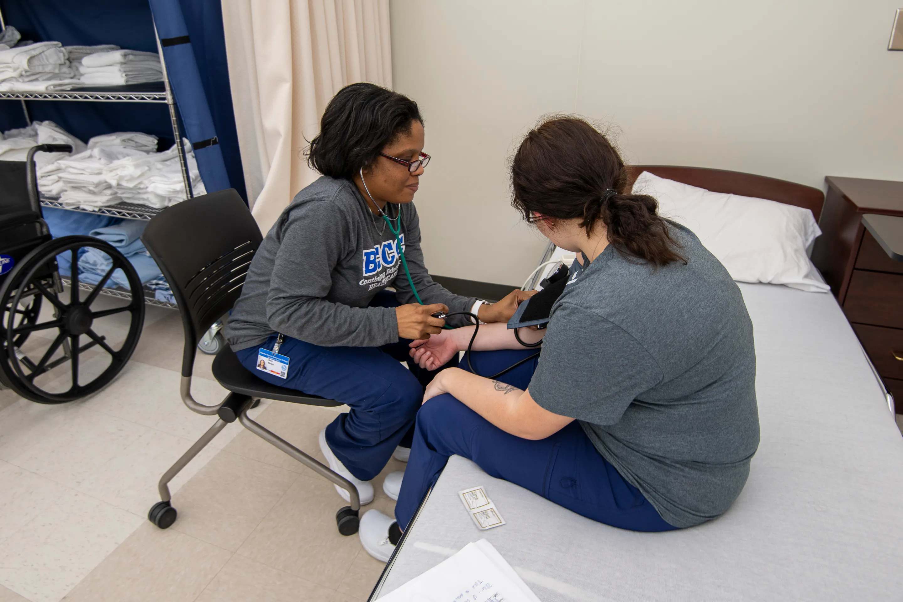 a student taking blood pressure