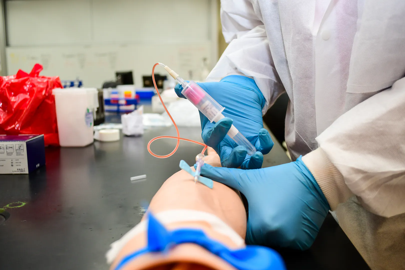 a person drawing blood