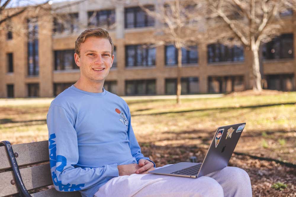 Student outside on Laptop