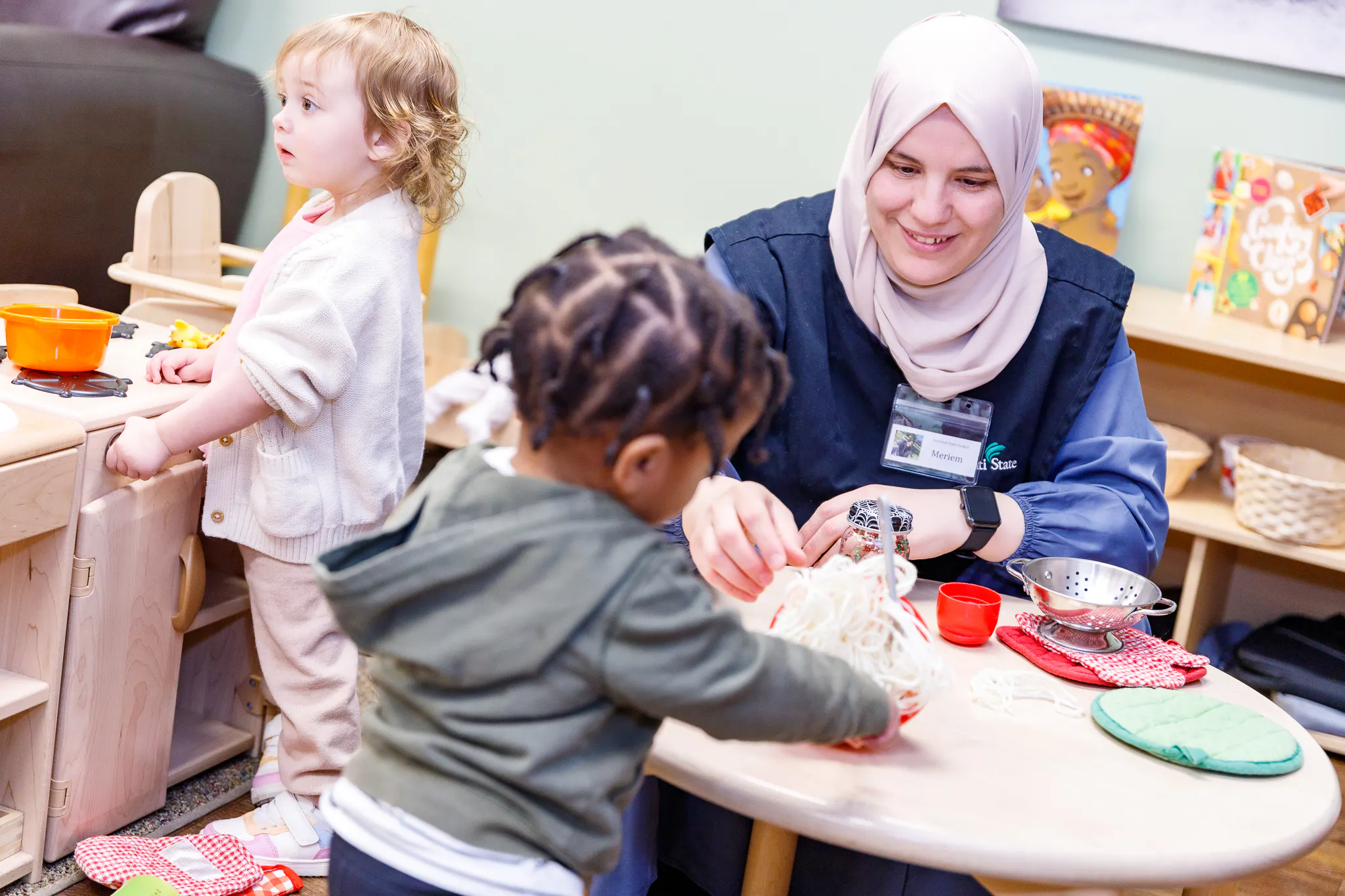 Pre-school teacher with children