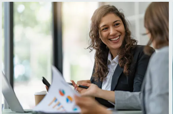 Women sharing financial data with colleague