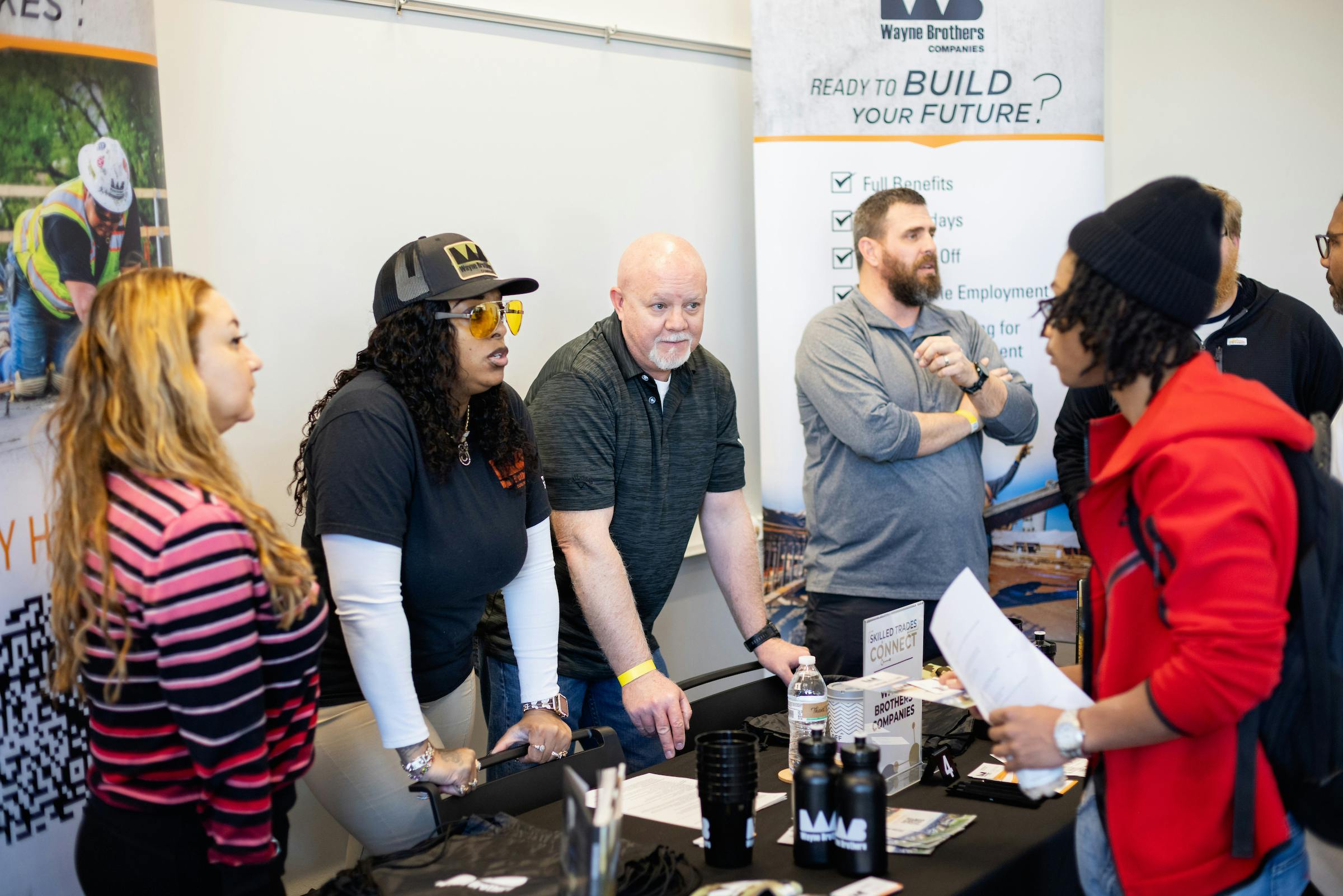 Students talking with employers at hiring event