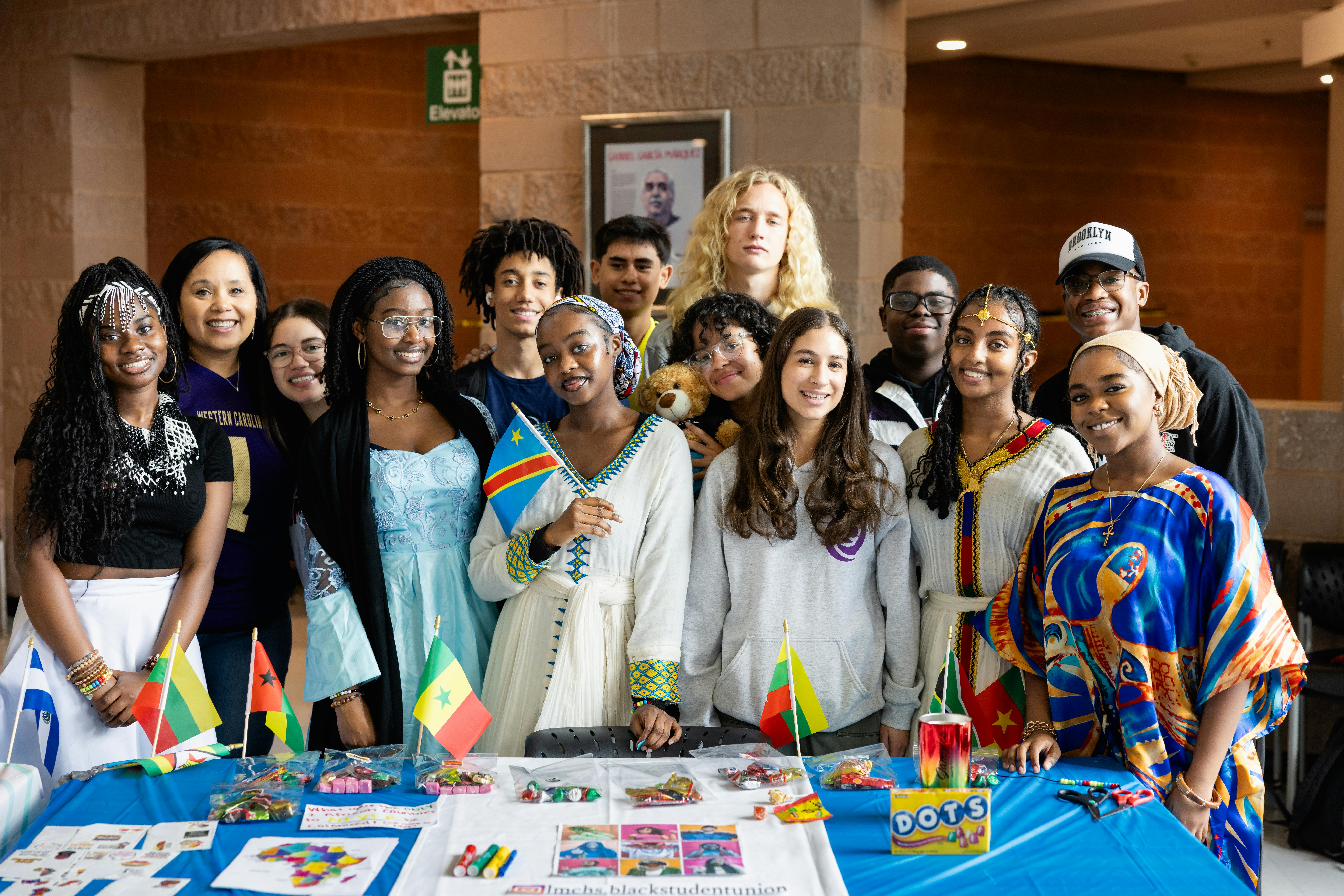 group of students at table with international flags
