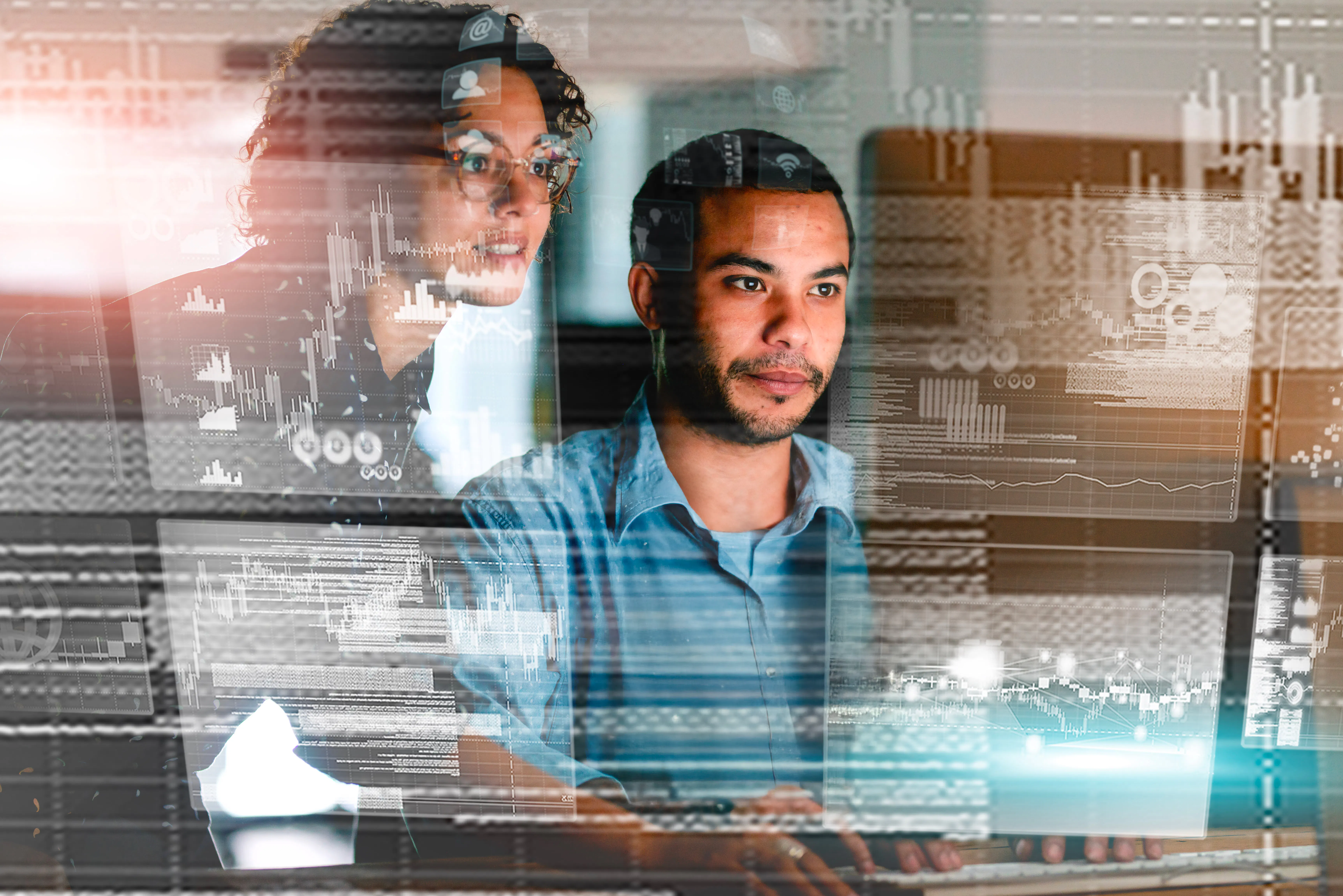 Two Data Analysts Collaborating with Data and HUD Graphics