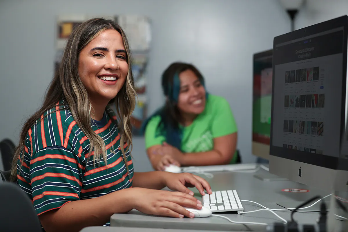 Female student sitting at computer
