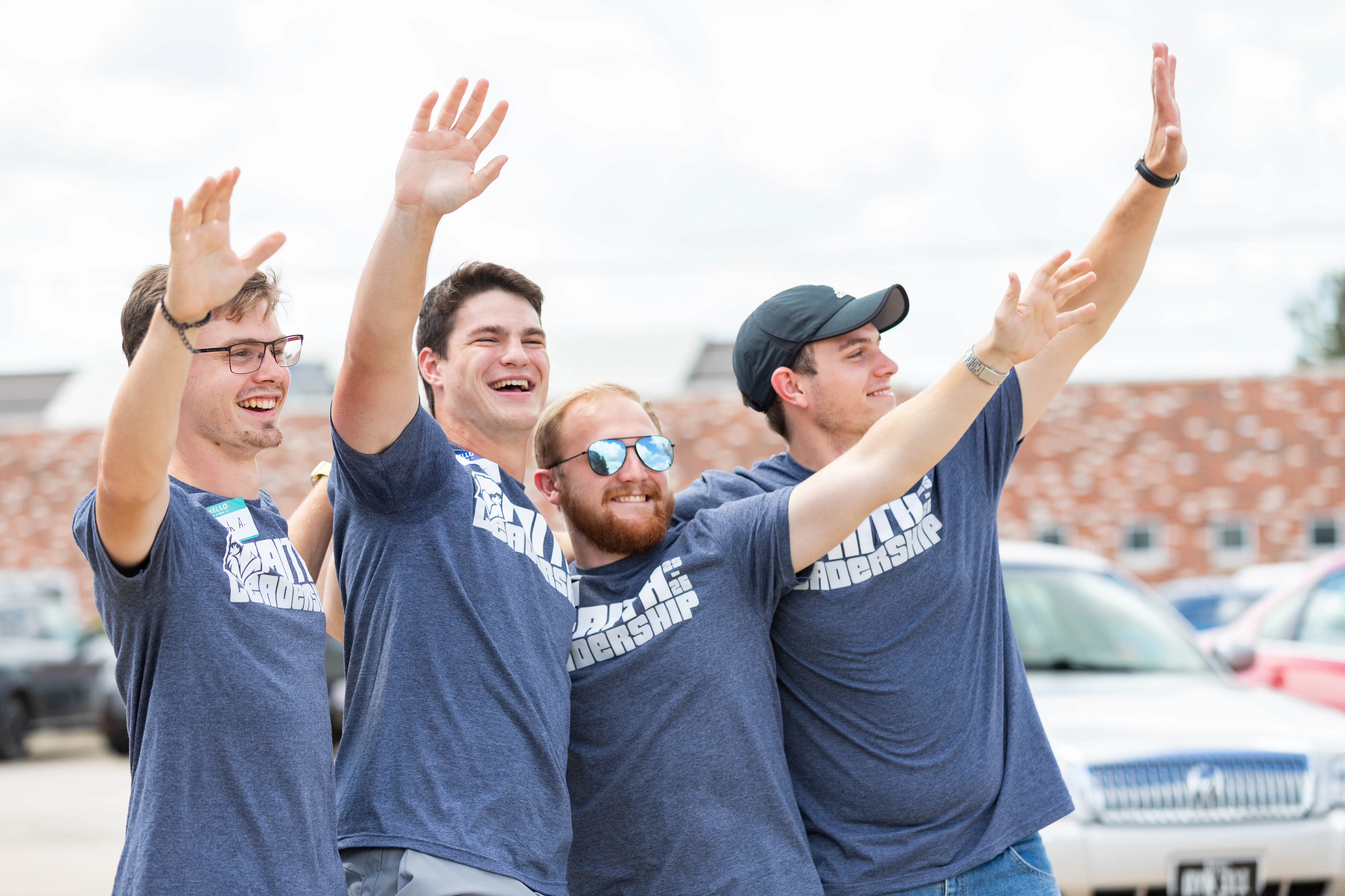 Faith Students waiving to new students 
