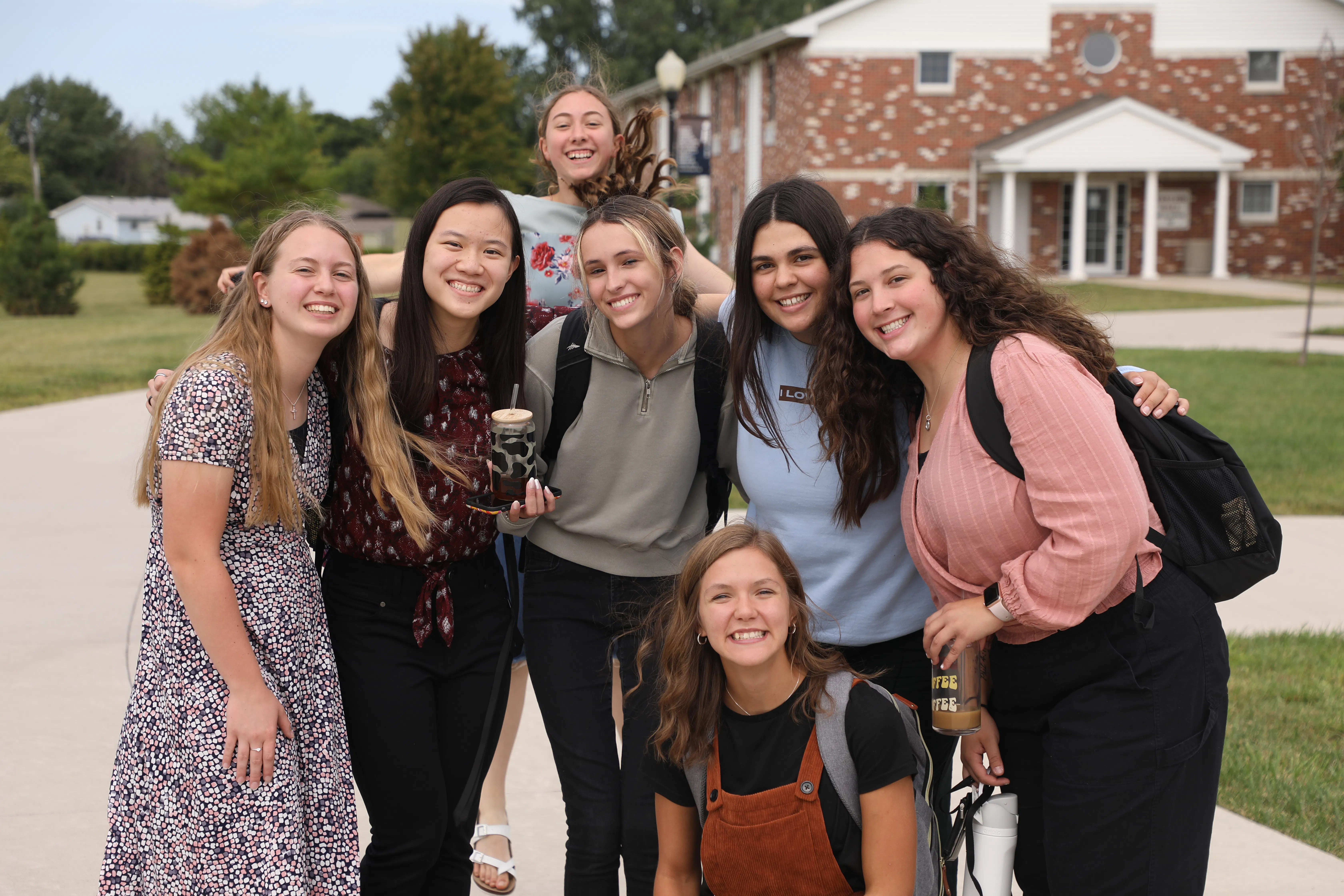 Faith students posing for a nice photo outside