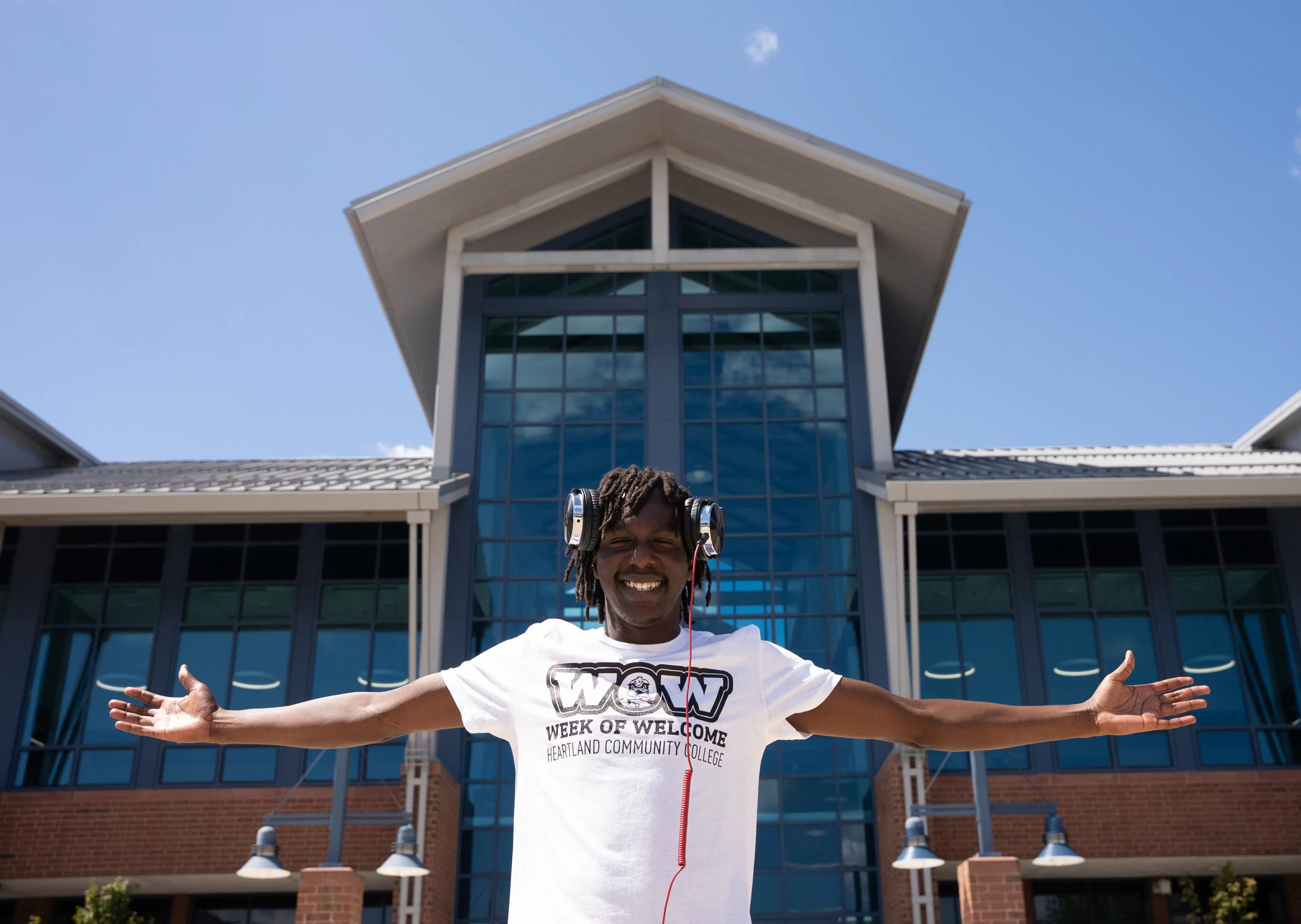 Image of student trustee, Aeman Lopeyok in front of the Student Commons Building on Heartland's campus.