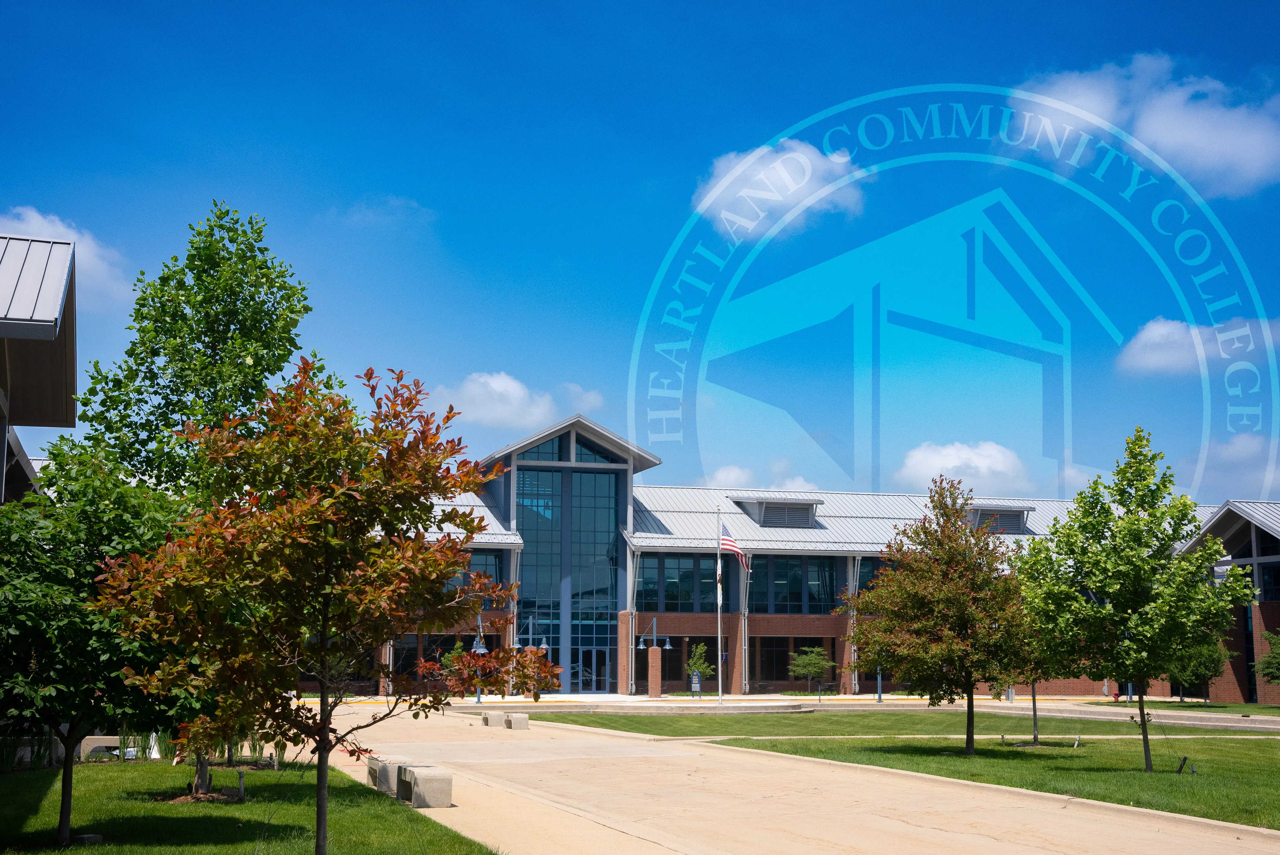 Heartland Community College campus with the Heartland seal in the background
