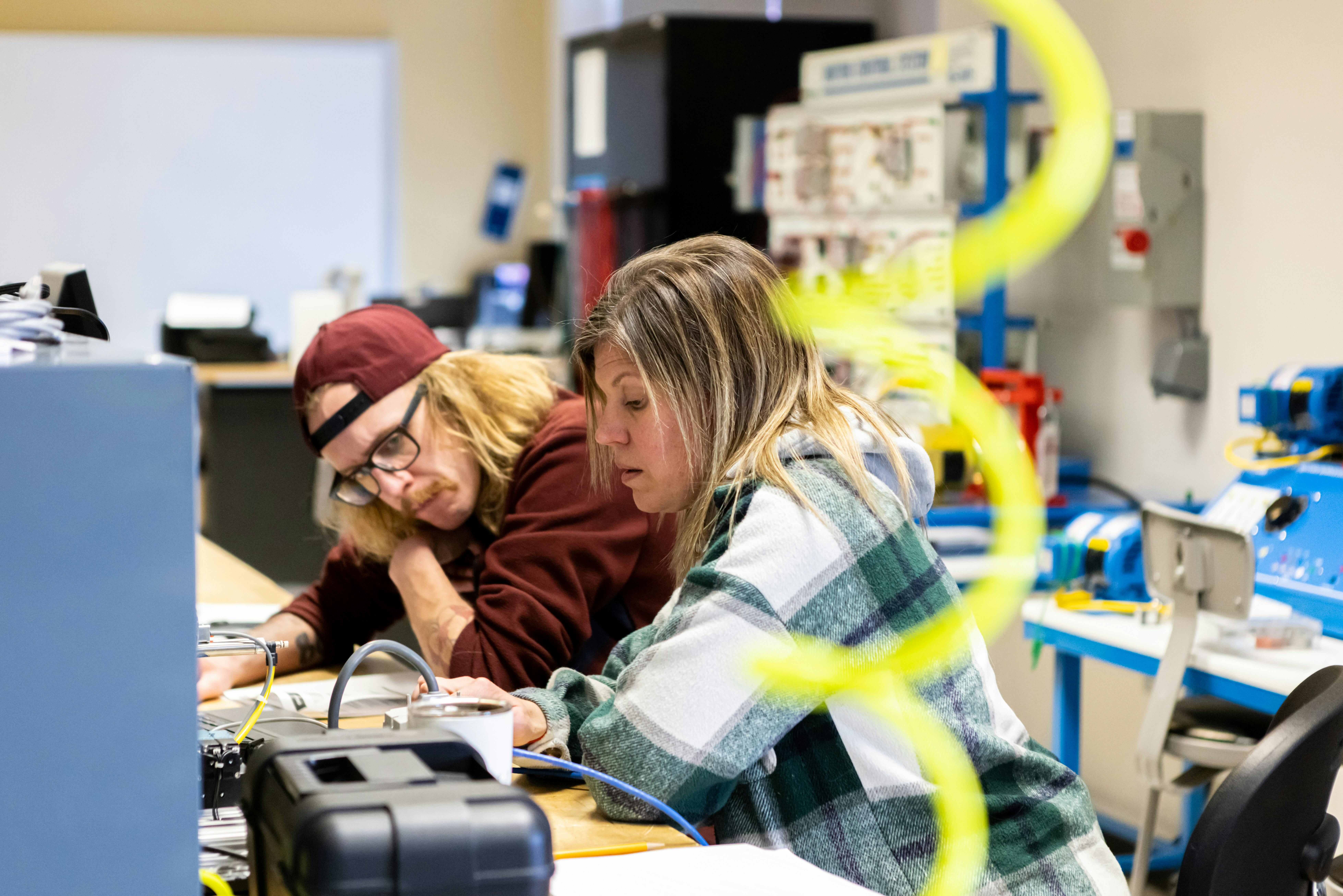 Students in industrial technology working together on a project