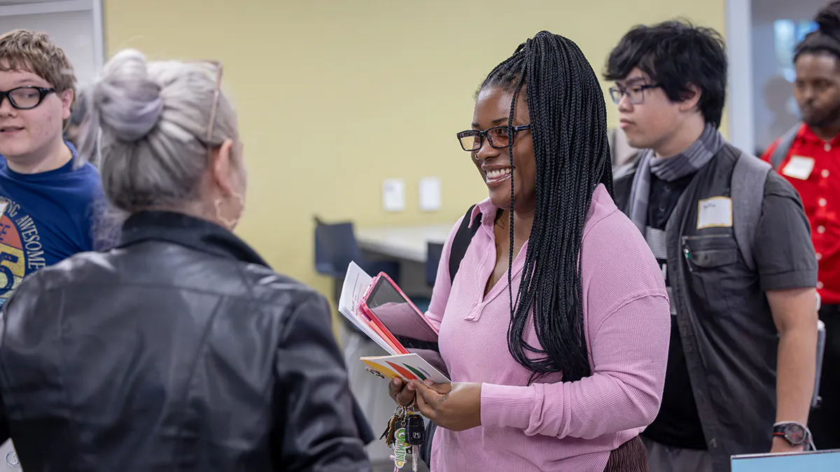 Students mingle with prospective employers at a JCCC job fair.