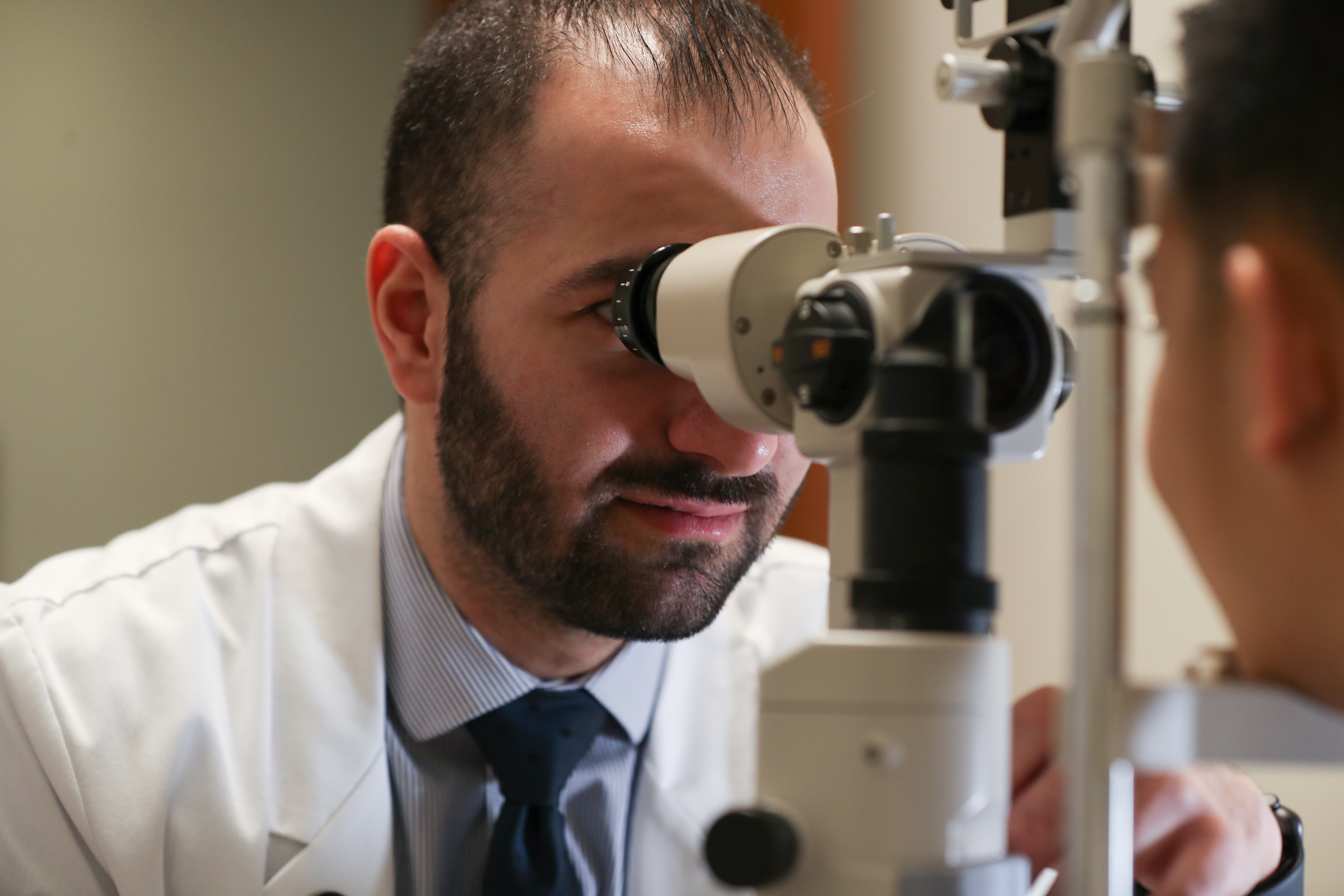 Student optometrist performing an eye exam