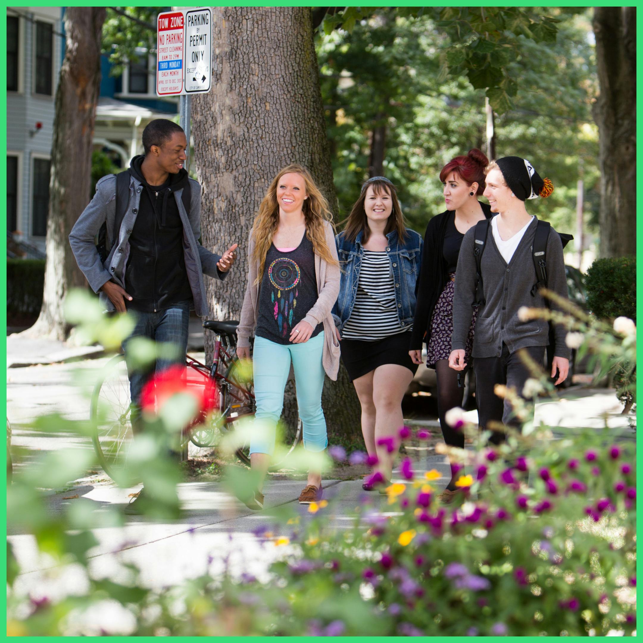 group of diverse students walking in town