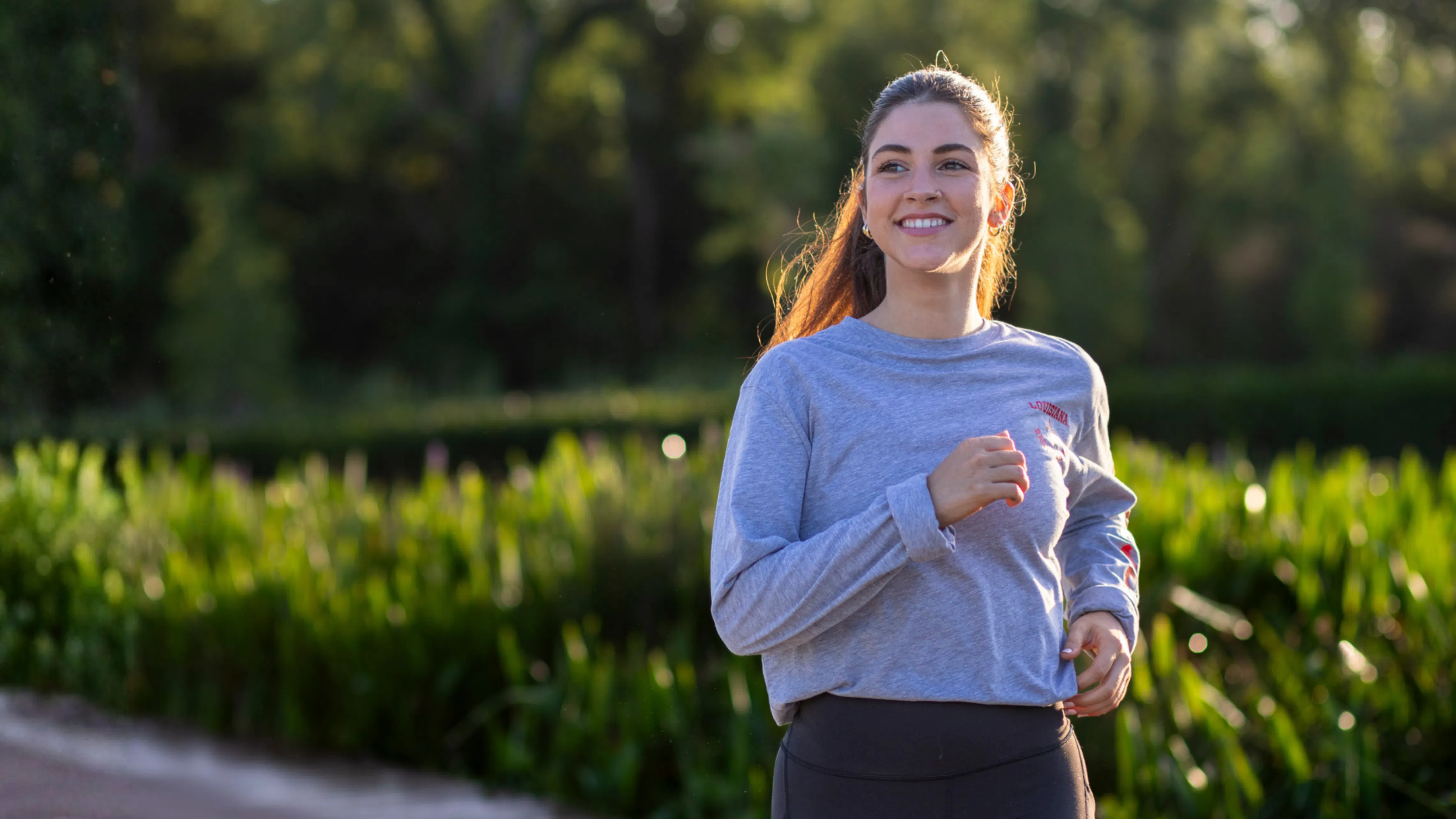 Image of a woman jogging outdoors. 