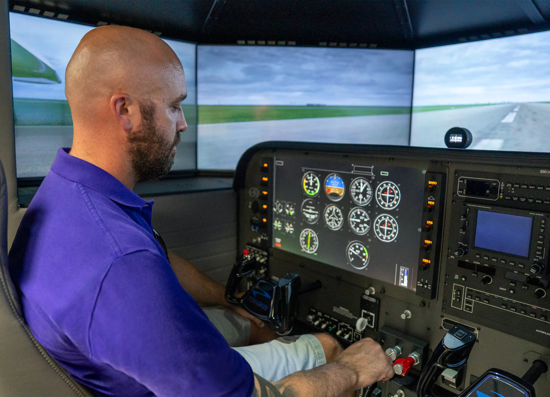 An LSUA Aviation Student using the advanced flight simulator.