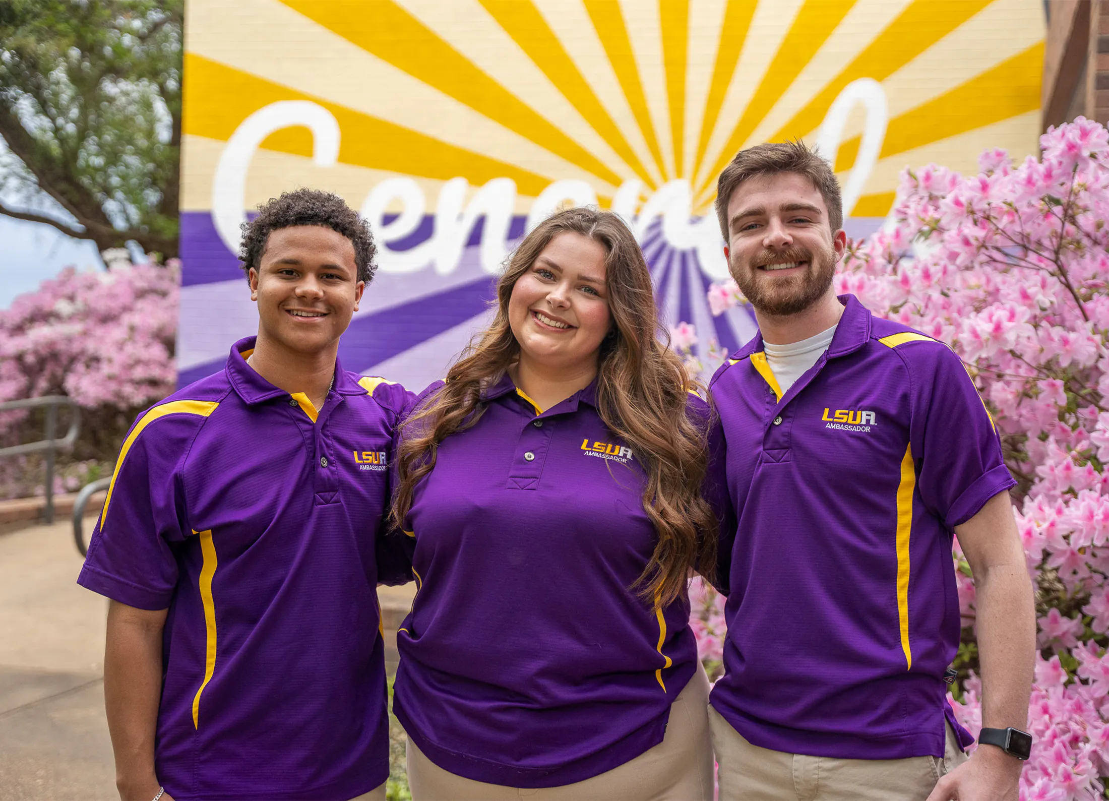 LSUA Ambassadors standing in front of the "Generals" mural.