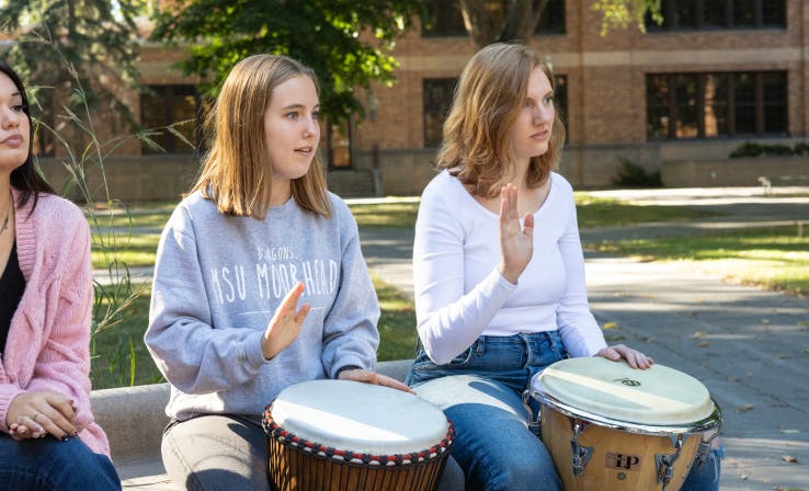 Students playing drums 