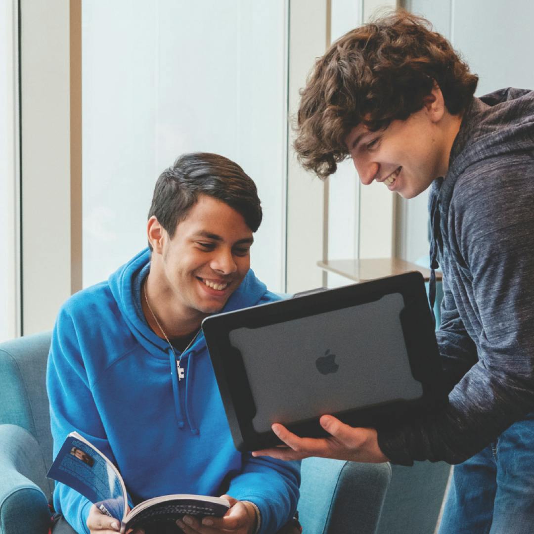 students looking at ipad