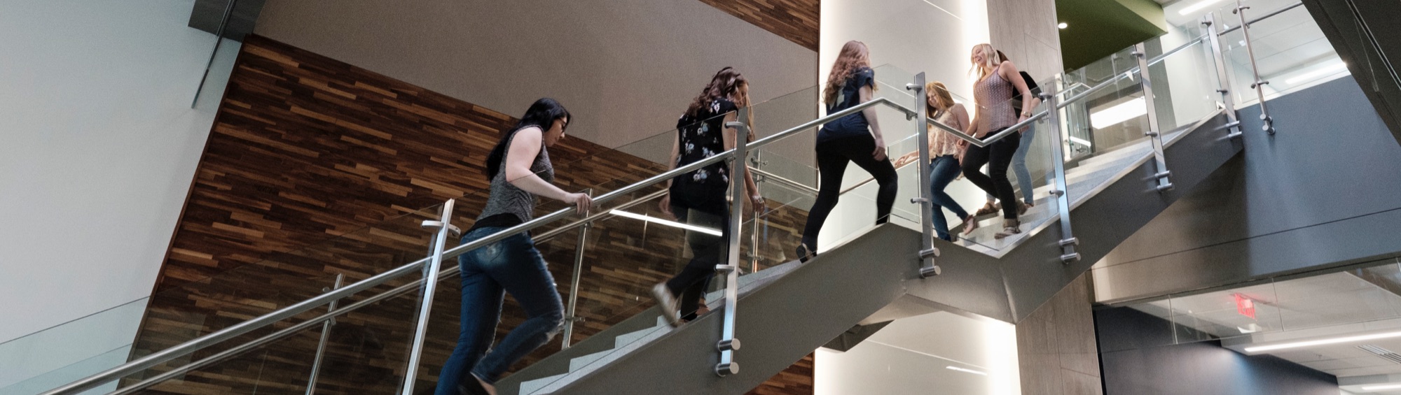 Students on stairs on campus