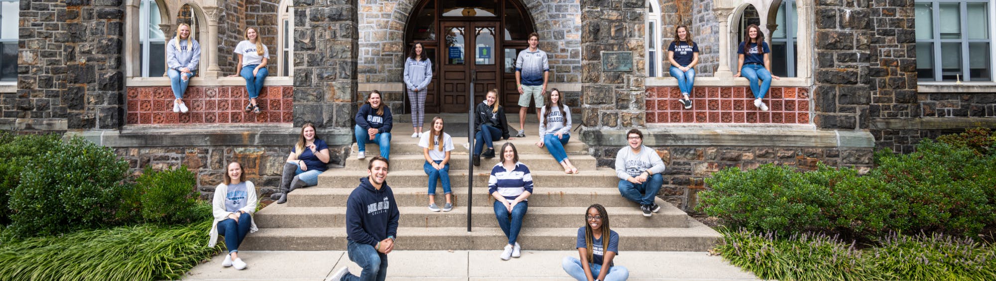 Students on stairs on campus