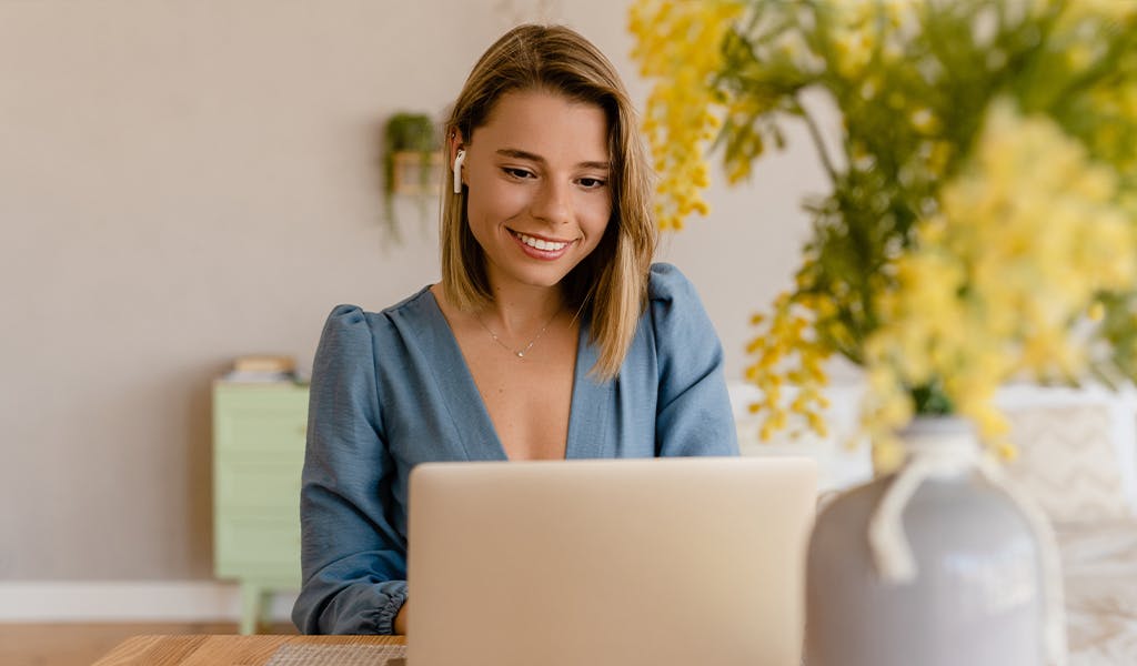 Smiling MBA Student on laptop