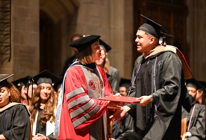 Photo of student receiving diploma