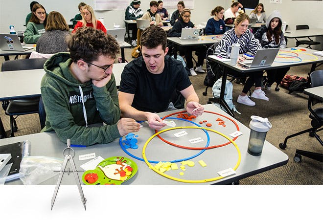 Two students learn techniques teaching elementary school math class.
