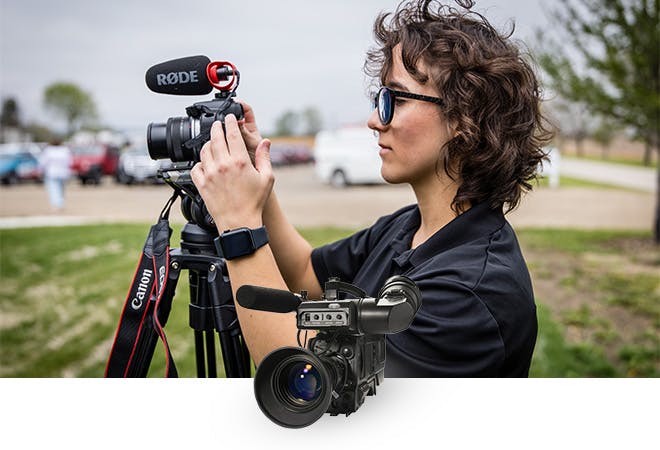 Alexis sets up a shot for a story.