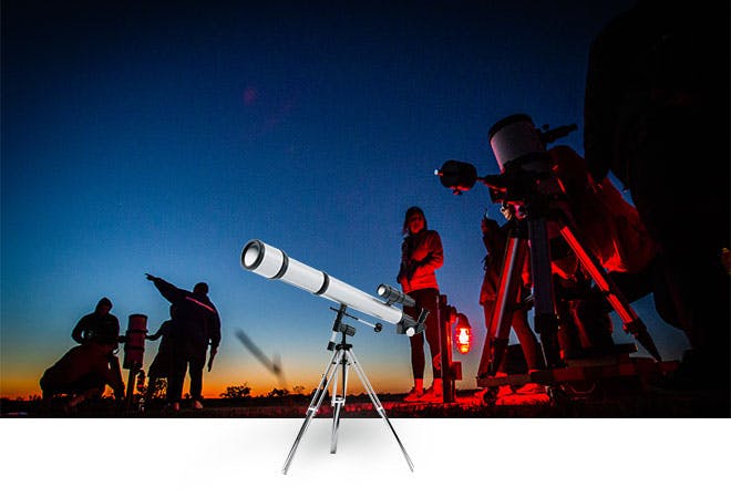 Astronomy club looks at the evening sky.