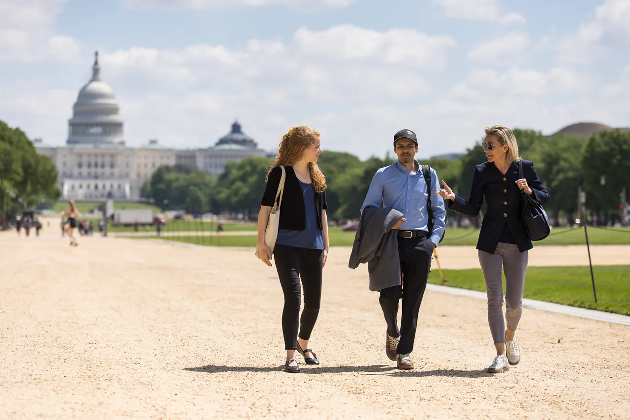 Students walking on the National Mall with the Capitol in the background