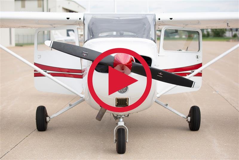 straight on image of a plane at the Cape Girardeau Regional Airport, parked, with the doors open