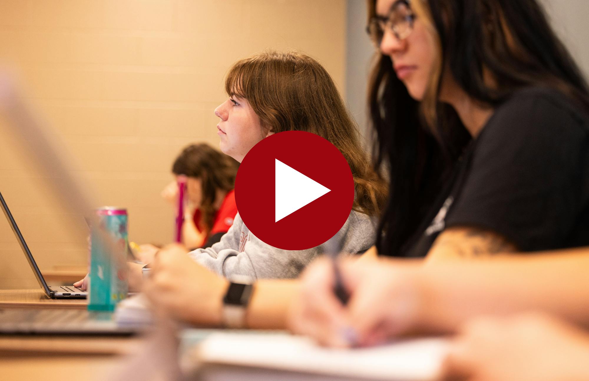 thumbnail image of a student in class for a video of a question and answer about the social work program with that student