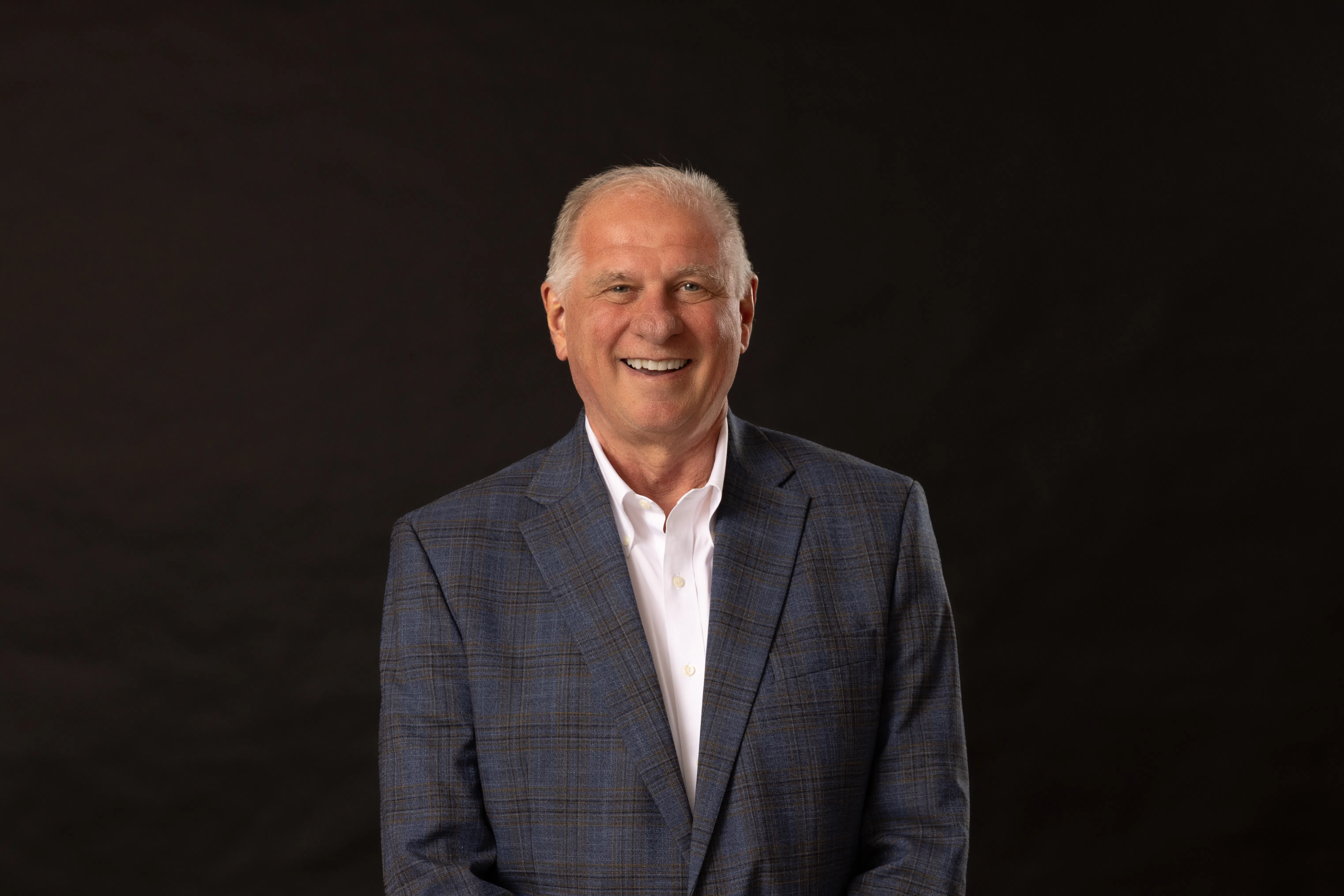 Mike Ward smiles for his university headshot. 