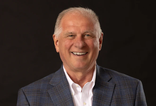 Mike Ward smiles for his university headshot.