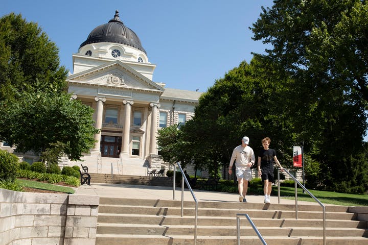 students walking in front of Academic hall