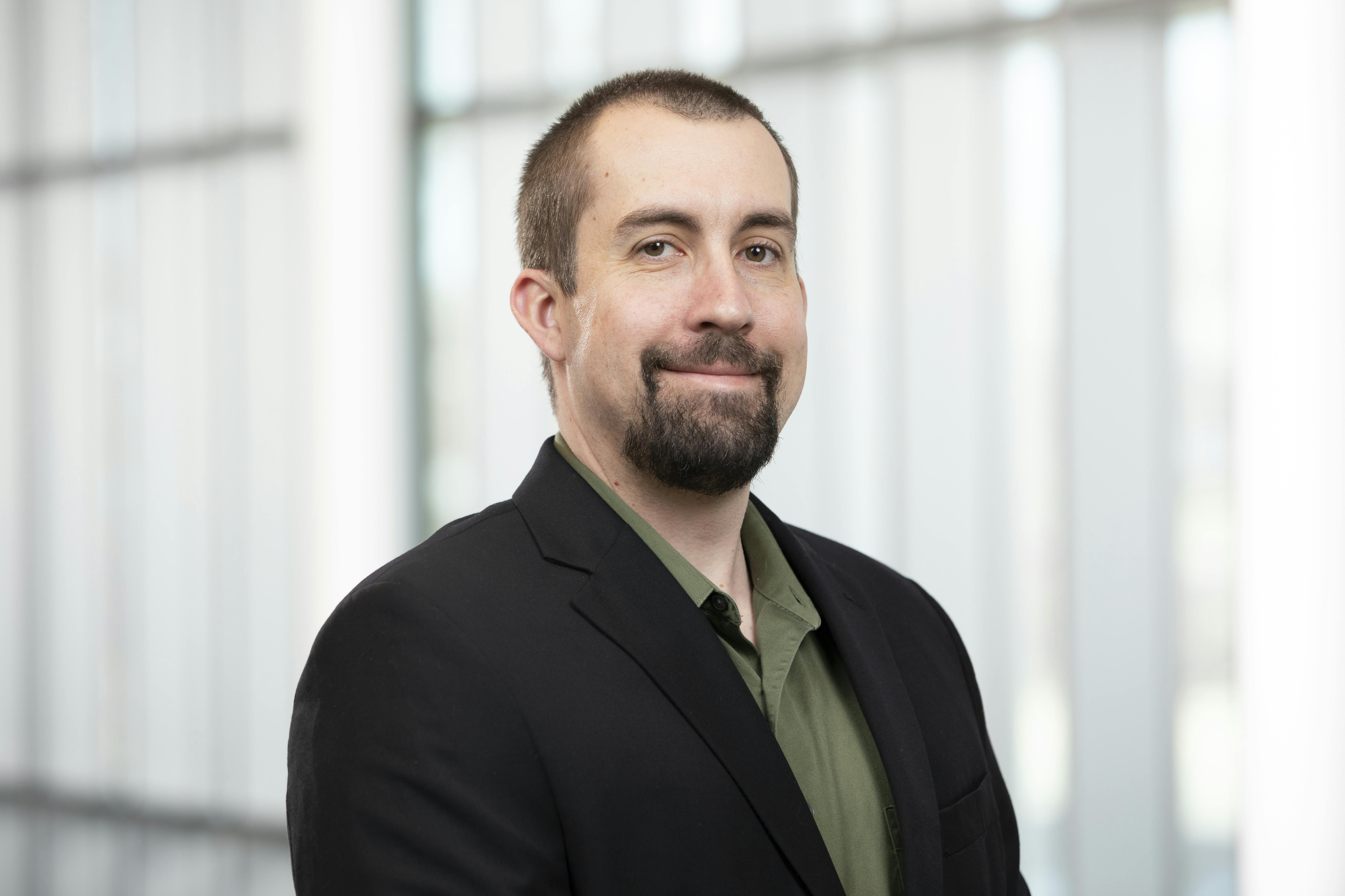 Professional headshot of Dr. Joshua Shadwick, associate professor for the department of criminal justice, social work, and sociology