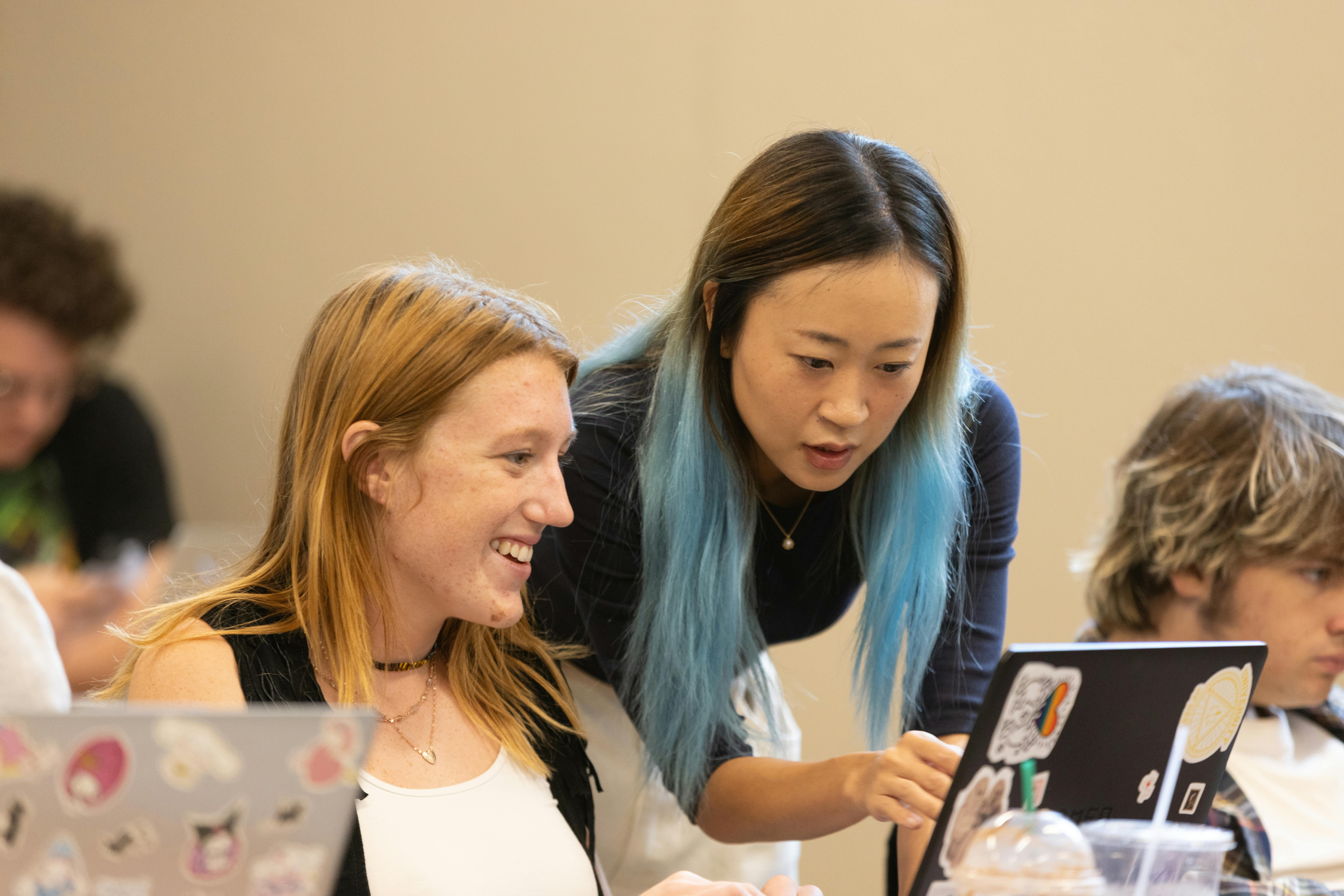 Professor working with a SEMO student in class