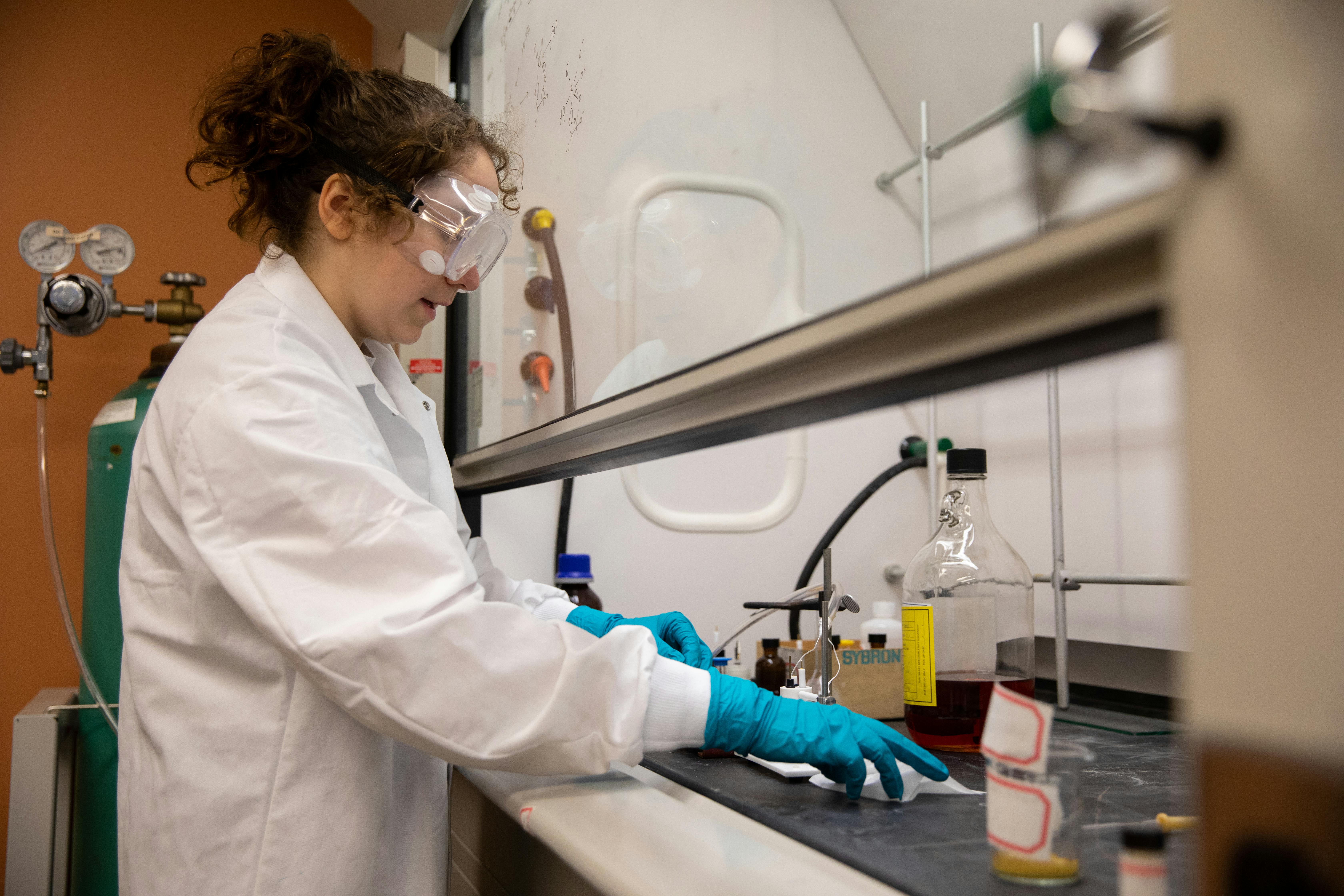 A student does research in one of the on-campus chemistry lab lol