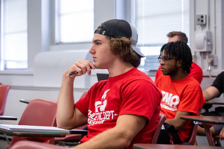 students taking notes in a classroom