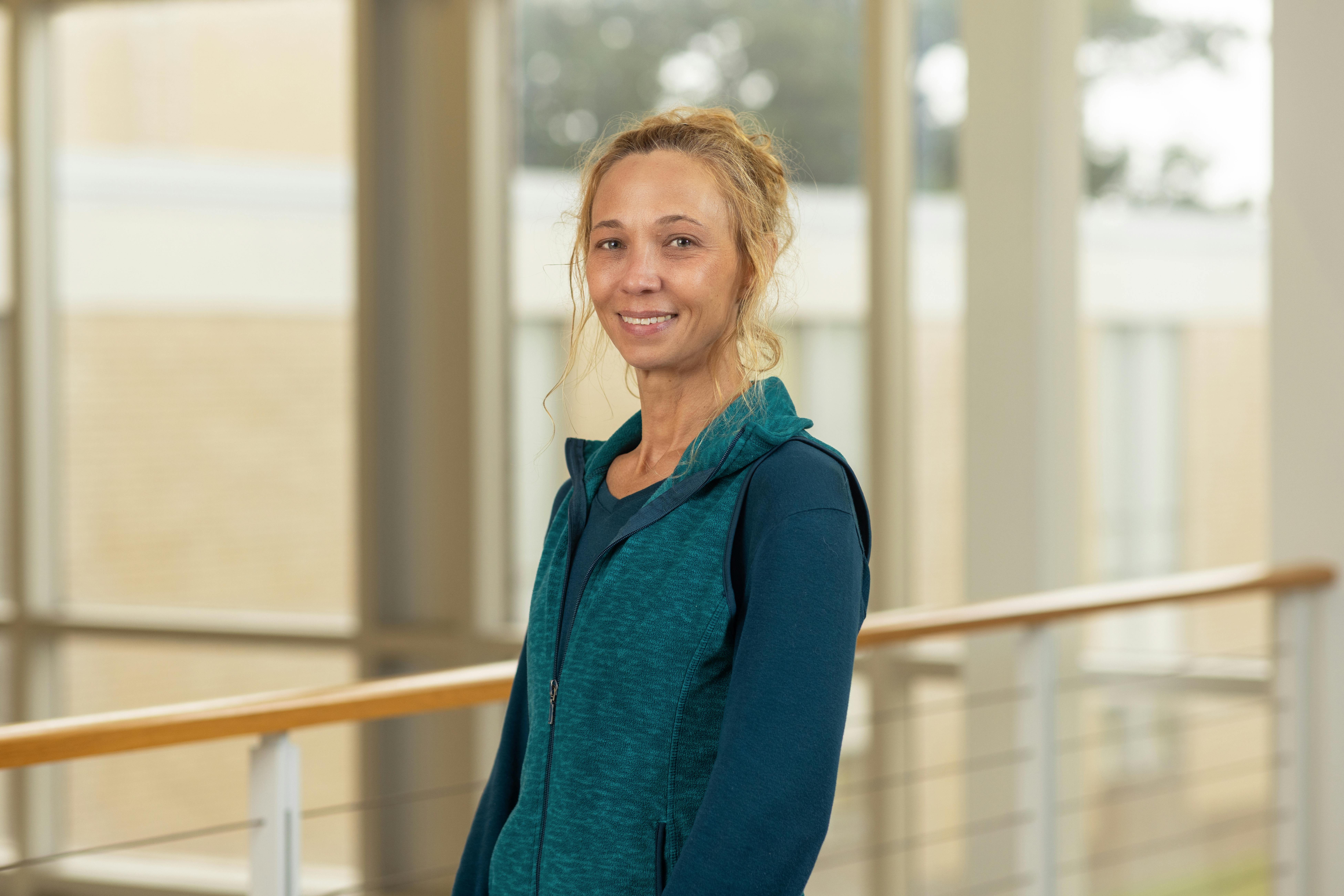 professional headshot of Dr. Courtney Kisat, professor in History and Anthropology
