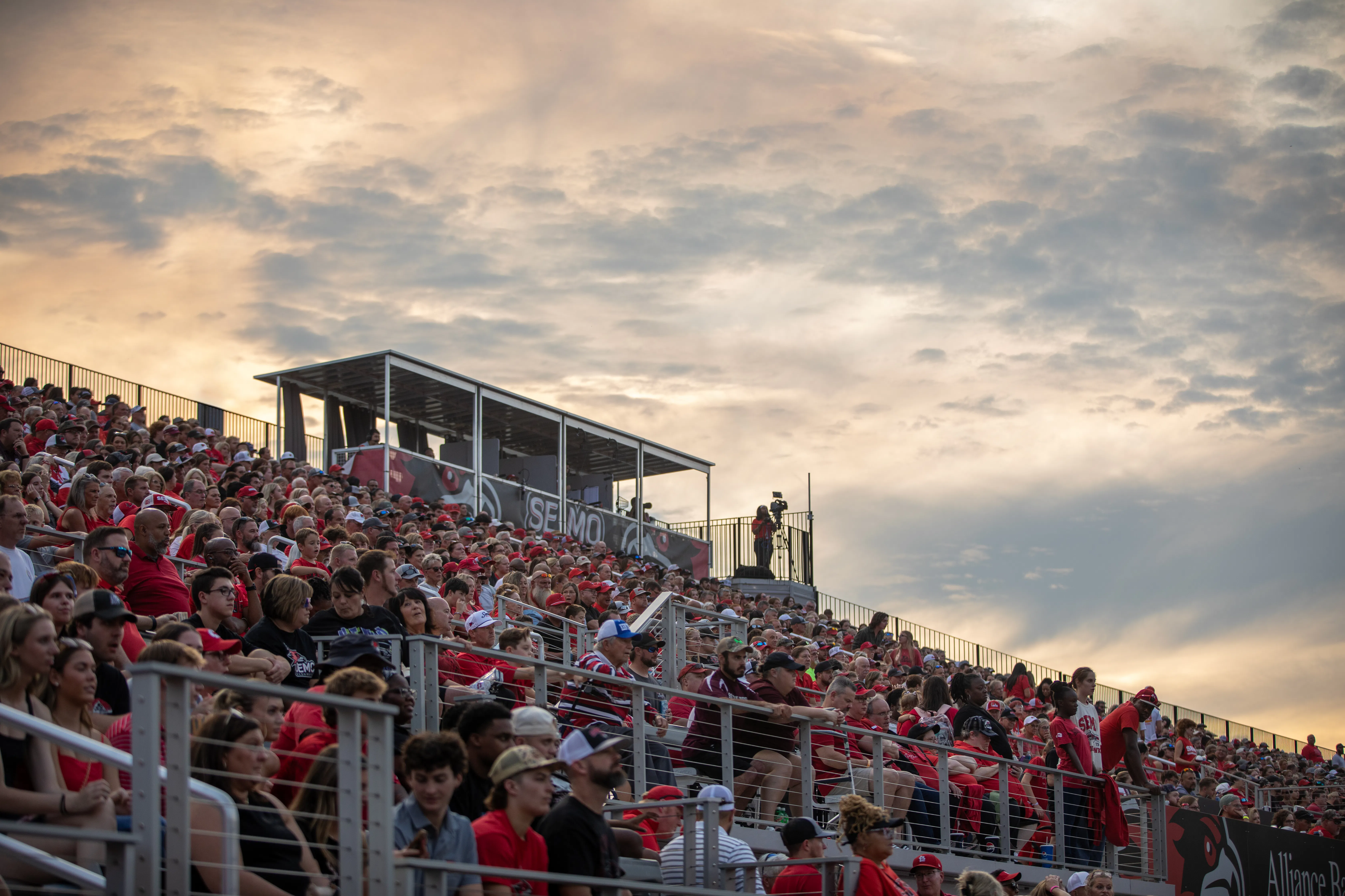 Crowd of fans seated in stadium stands at a SEMO event