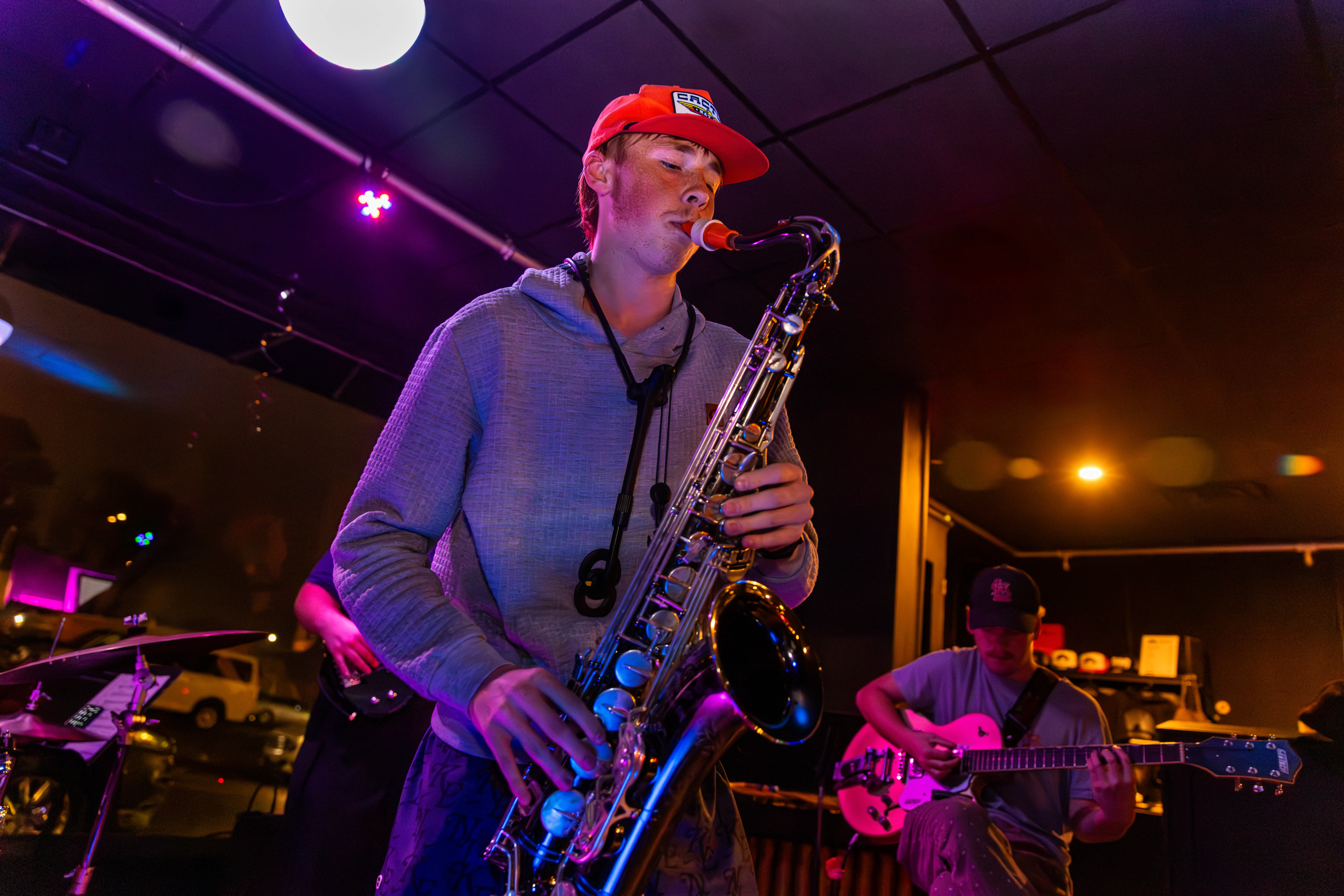 a student plays saxophone at a River Campus performance. 