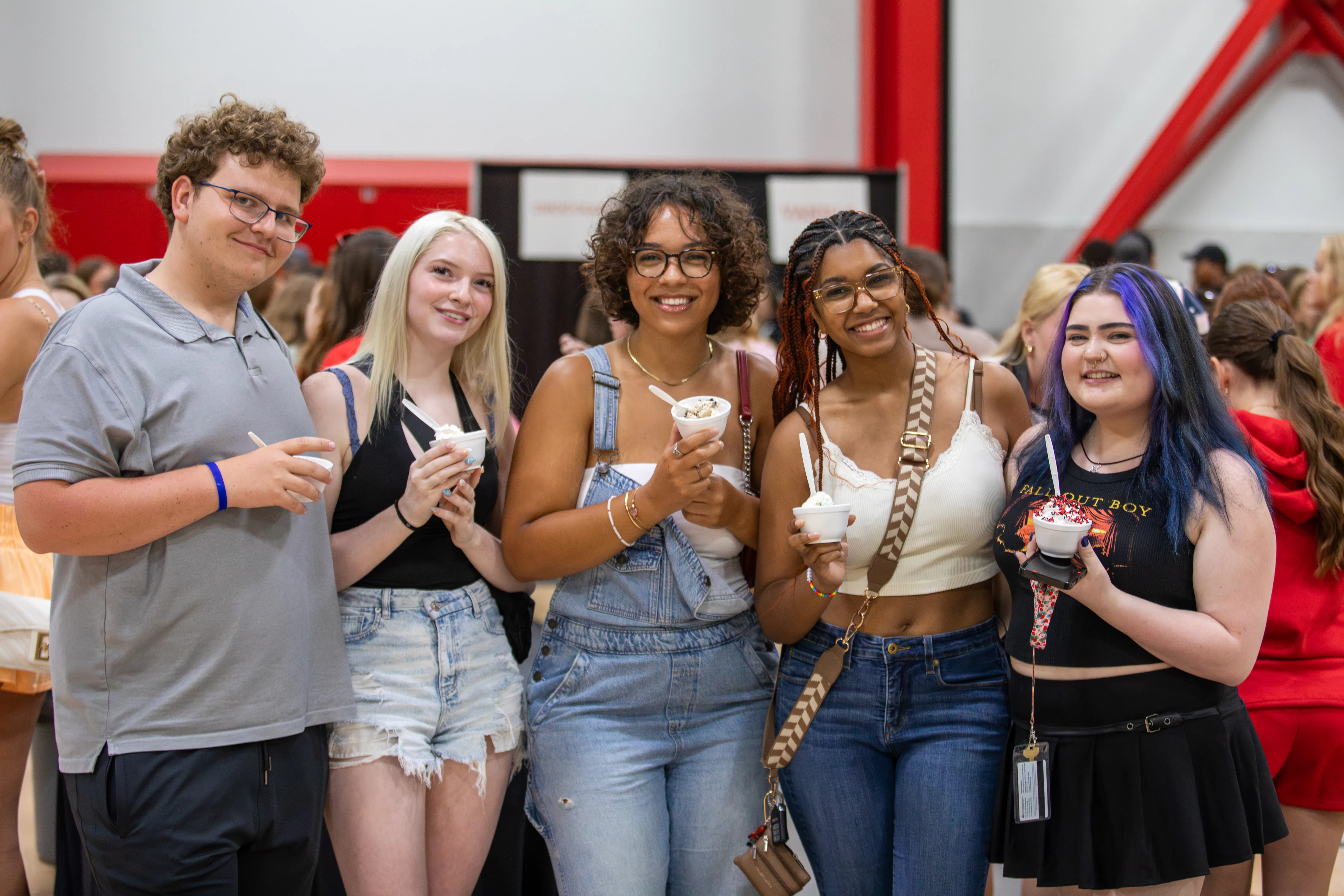 a group of students pose with their ice cream from the ice cream pig out.