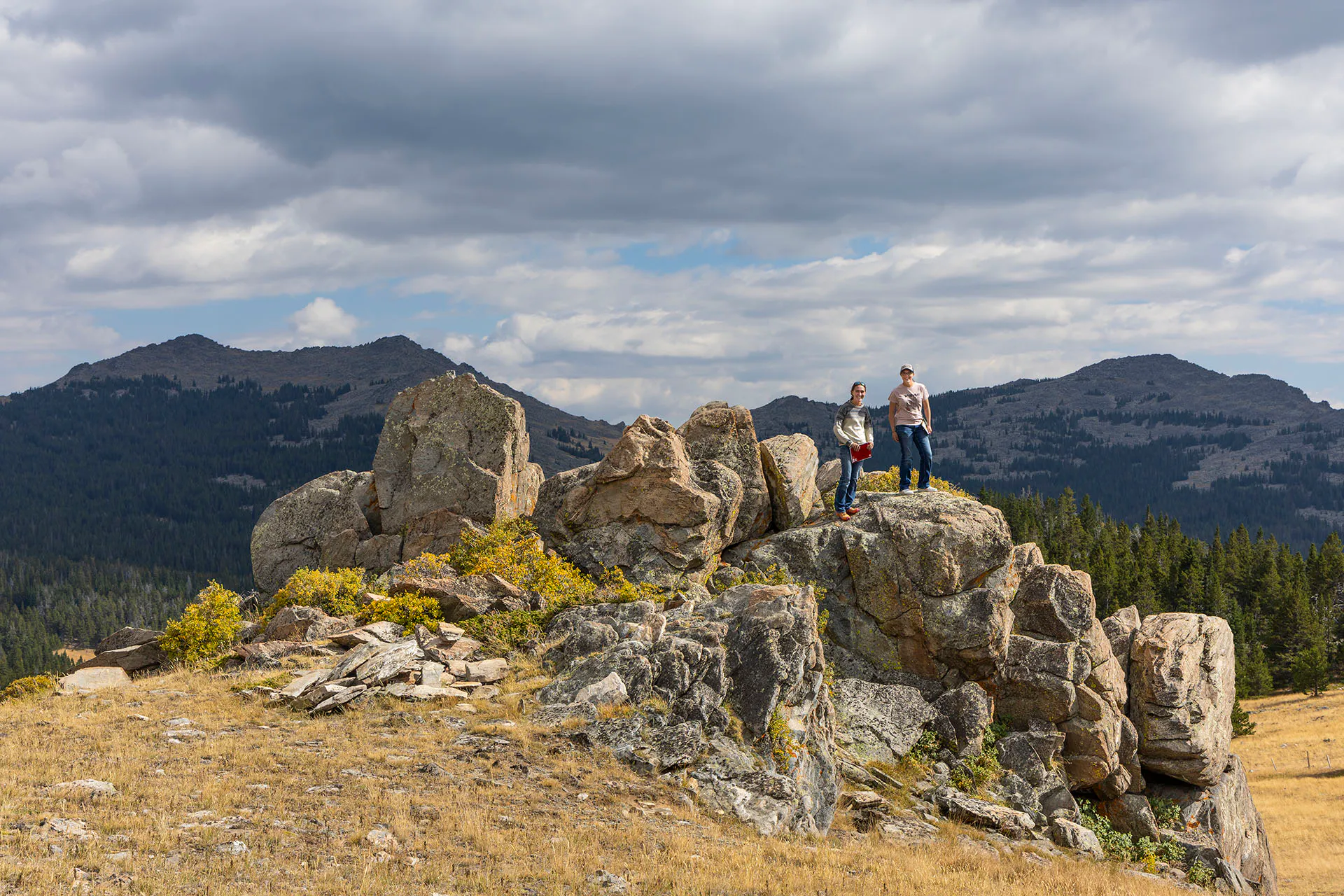 Students on rocks in the mountains