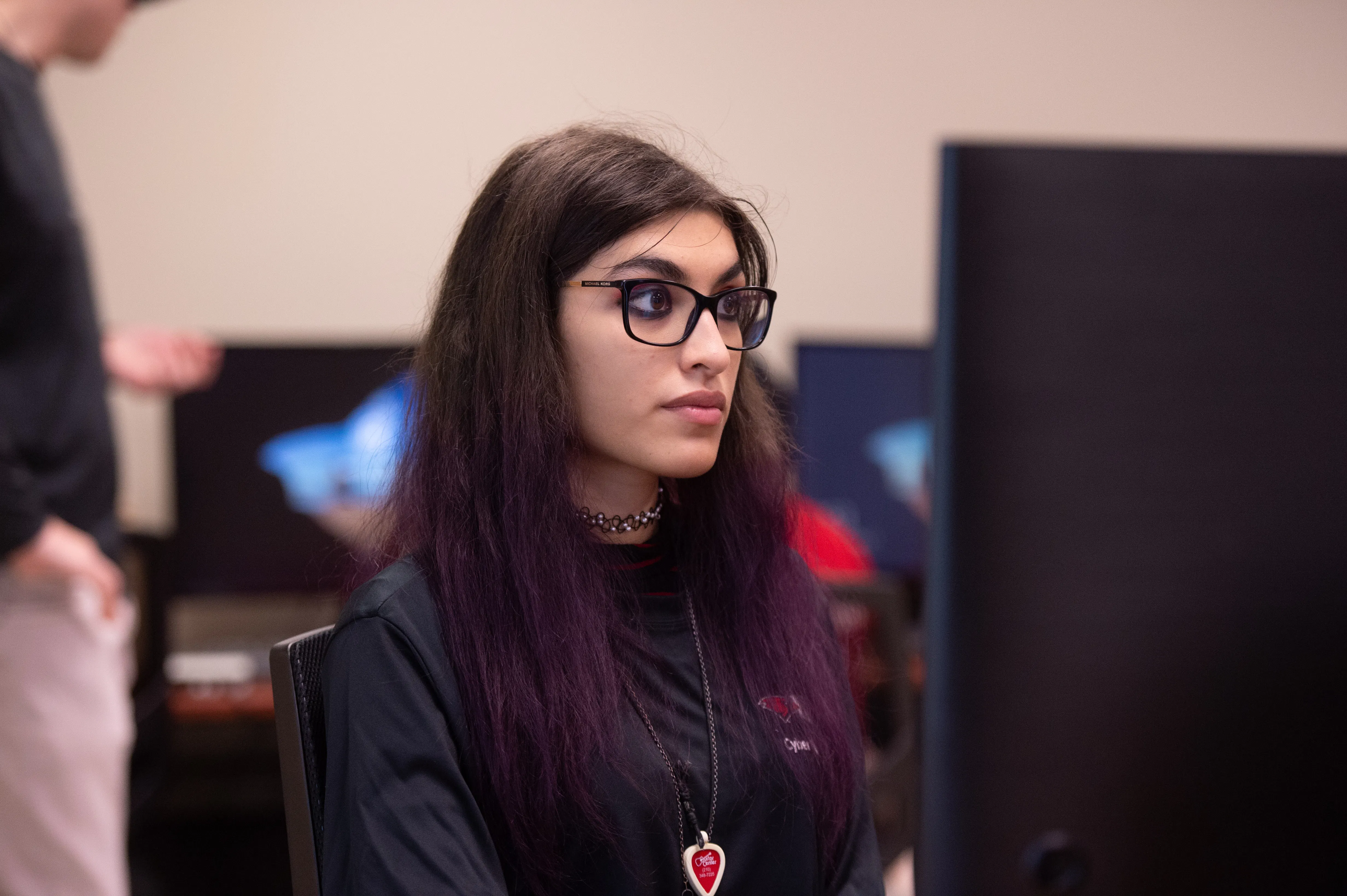 Female data science student studying in class looking at computer screen